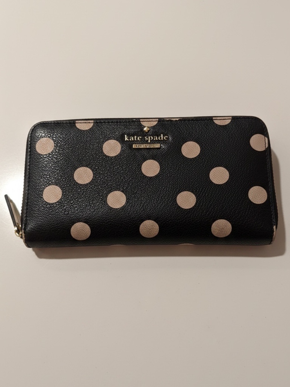 Kate Spade black leather polka dot zip-around continental wallet with beige dots